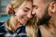 Man and Woman Smiling While Kissing