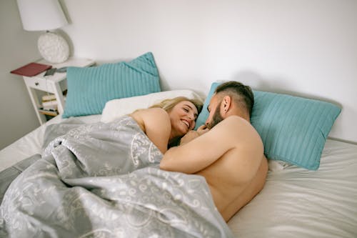 Free Couple Lying in Bed Together Stock Photo