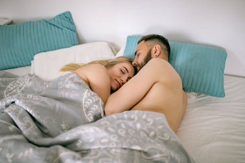 Free Couple Sleeping Under Blank Stock Photo