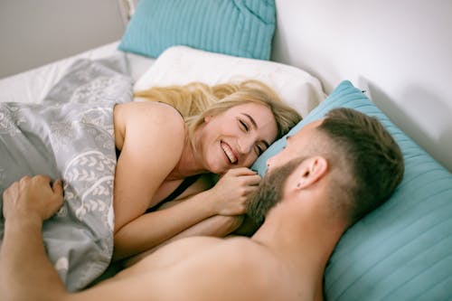 Couple Lying in Bed 