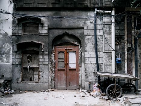 Rustic and eerie facade of an abandoned structure in Faisalabad, Pakistan.