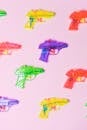 Assortment of colorful plastic guns for pretend fight