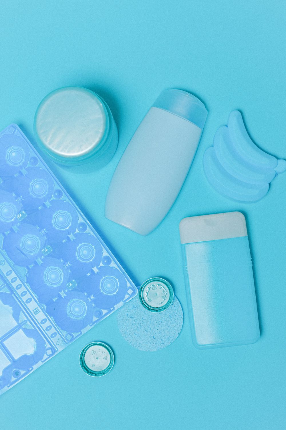 Multiple plastic products including containers, bottles, and household items