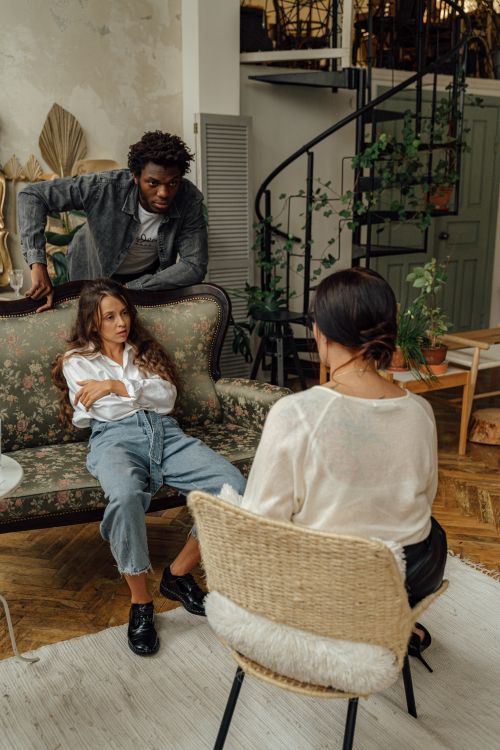 Free Intimate family therapy session in a stylish and cozy loft setting. Stock Photo