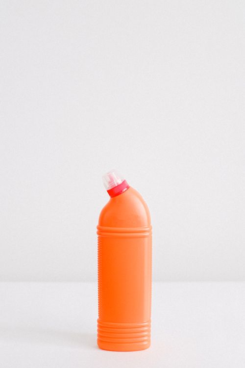 Free Plastic container of detergent for cleaning and disinfecting surfaces placed on white background Stock Photo