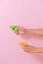 Crop person showing toy pistols