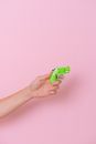 Crop hand with plastic pistol