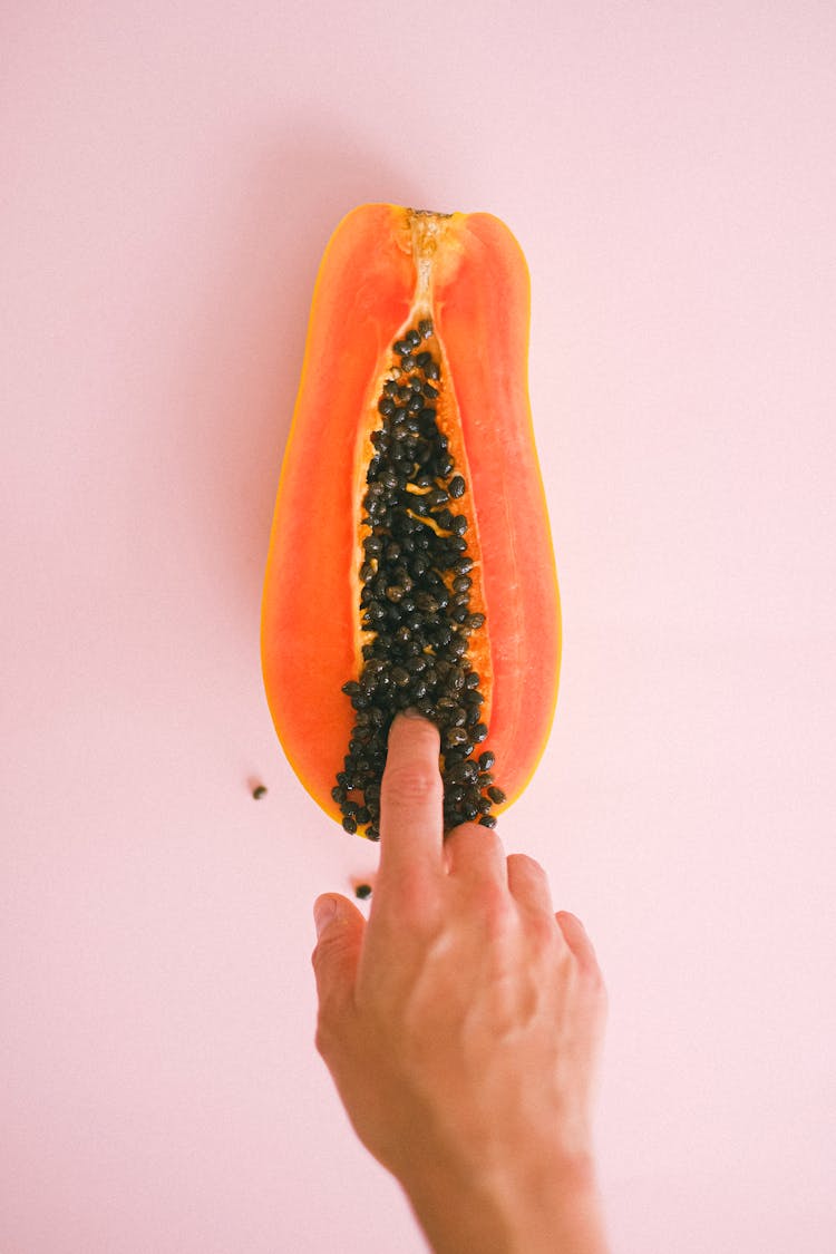 Crop Faceless Woman Touching Cut Sweet Papaya