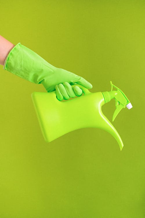Crop unrecognizable person demonstrating watering can
