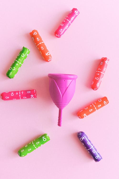 Pink Menstrual Cup and Tampons