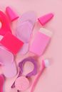 Composition of cleansing tools on pink background