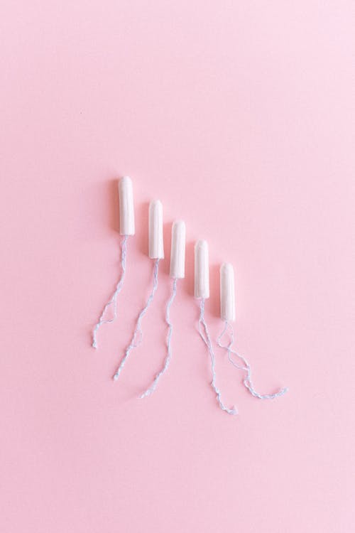Free Hygienic tampons arranged on pink surface Stock Photo