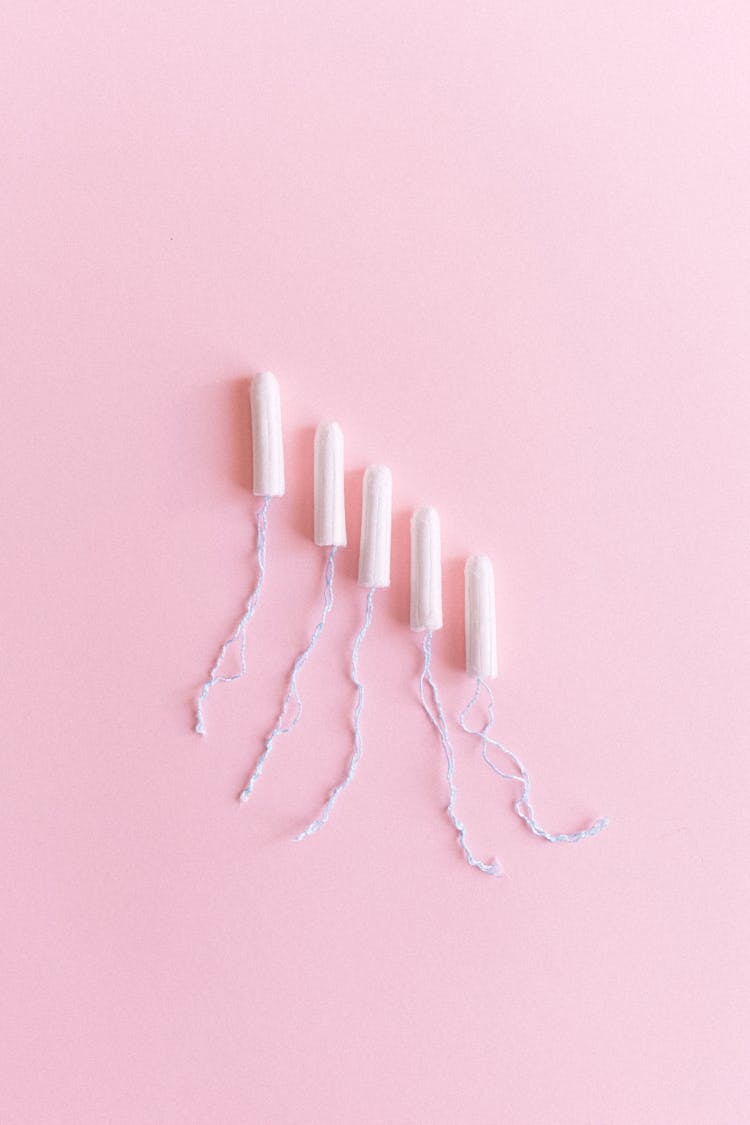 Hygienic Tampons Arranged On Pink Surface