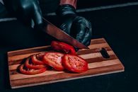 Red Bell Pepper on Brown Wooden Chopping Board