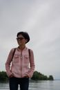 Smiling Middle-aged Woman near Water