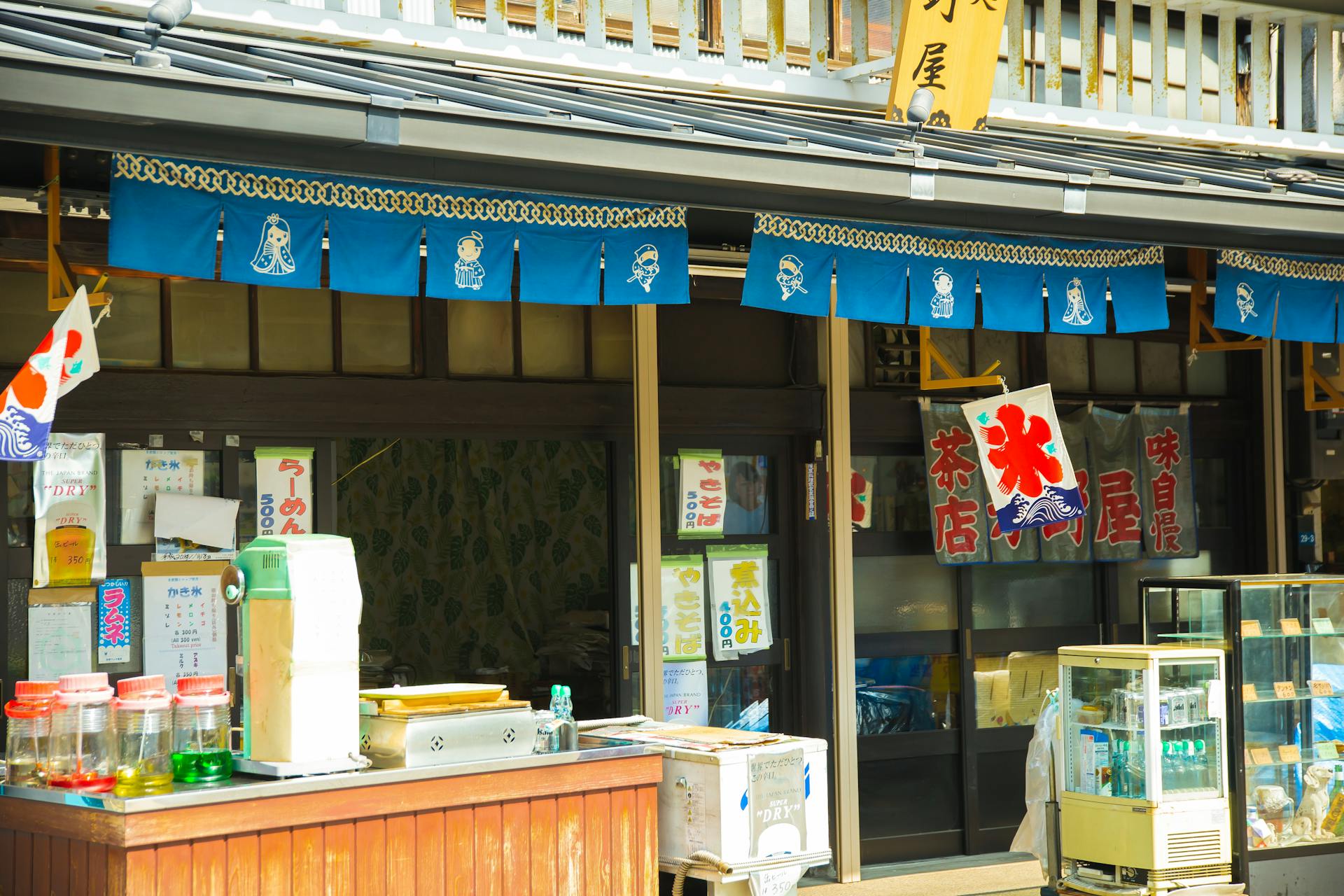 Local Asian street shops with showcases in city