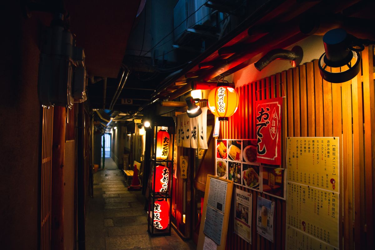 Izakaya alley with red lanterns in Japan at night — the kind of neighbourhood dining culture found throughout Chiba's commuter towns
