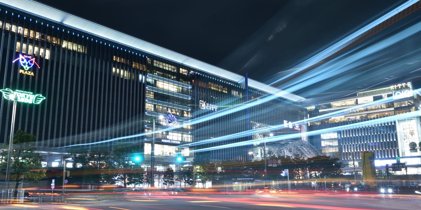 Night cityscape of Fukuoka, Japan, with light trails and modern buildings
