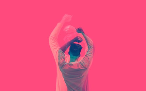 Artistic Pink Wallpaper with Silhouettes of Dancing Man
