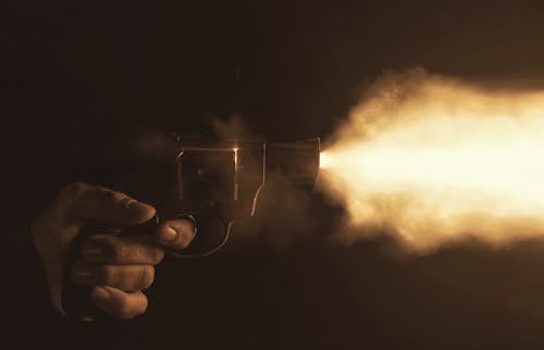 Person Firing a Gun