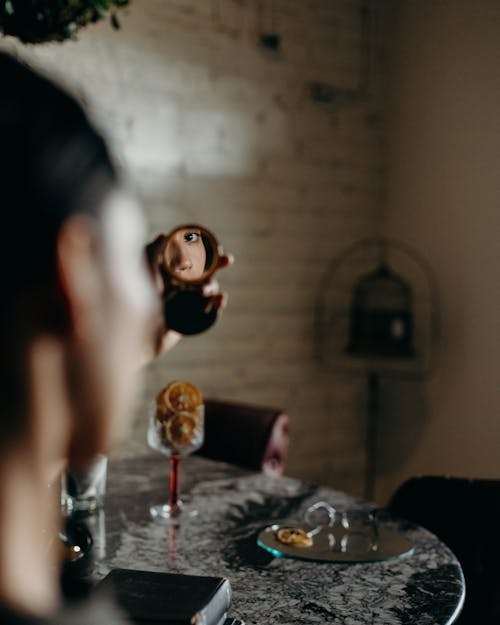 A Person Holding a Mirror