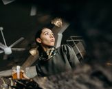 Woman Holding a Cup with Beer
