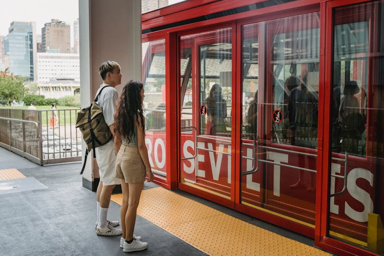 Anonymous Multiethnic Couple Waiting For Cable Car On Platform