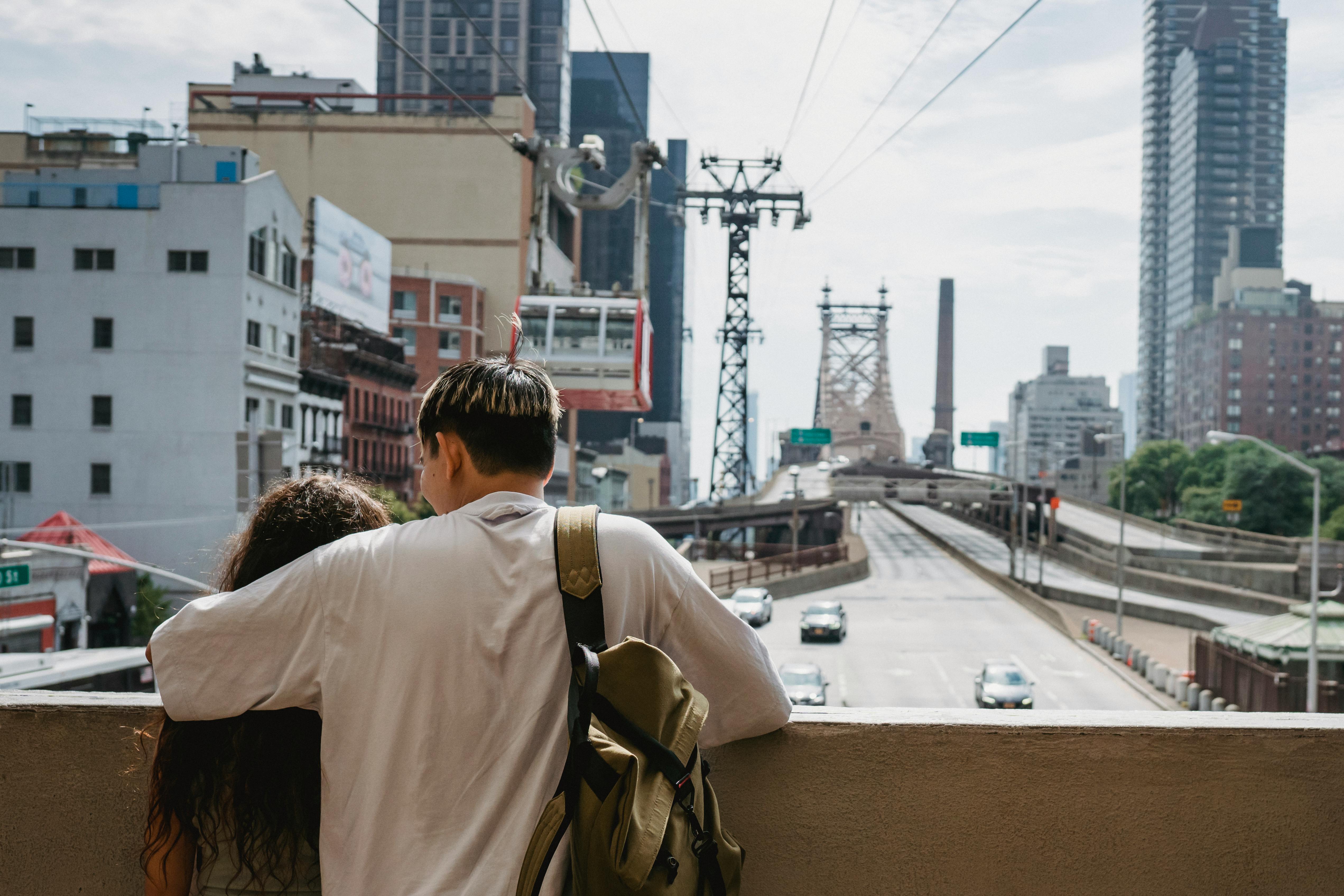 unrecognizable couple hugging and enjoying new york city views