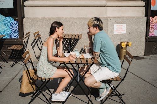 Free Happy diverse couple having breakfast at table Stock Photo