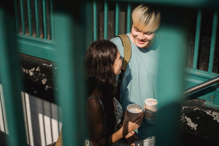 Happy Smiling Diverse Couple With Coffee