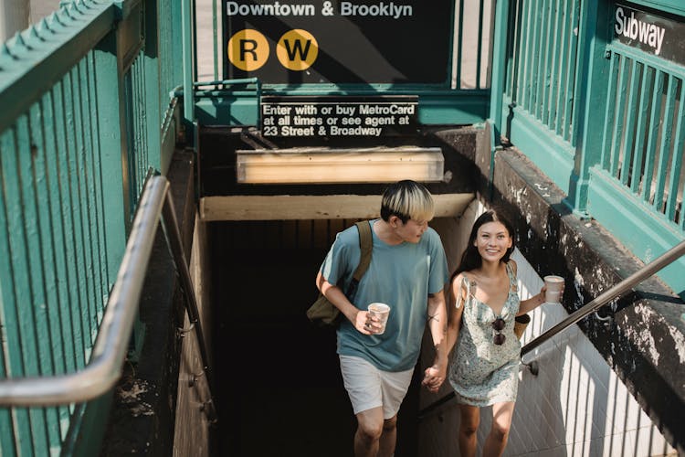 Asian Couple On An Underground Subway Station