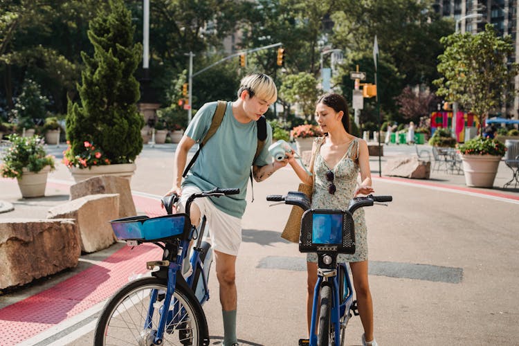 Diverse Friends On Bicycles Checking Camera