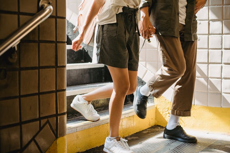 Couple Walking Down Stairs In City