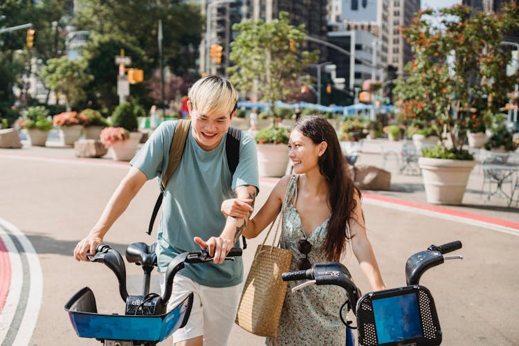 Cheerful Multiethnic Couple Walking On Street