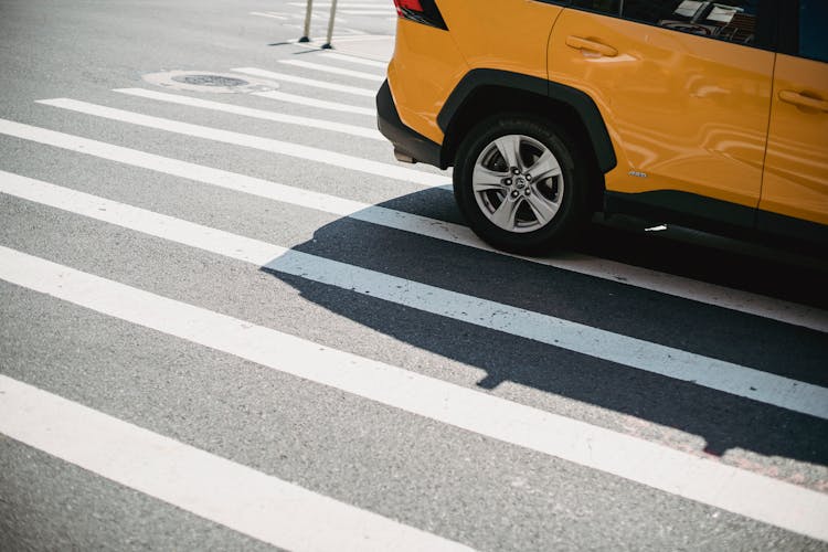 Modern Car Driving On Asphalt Road