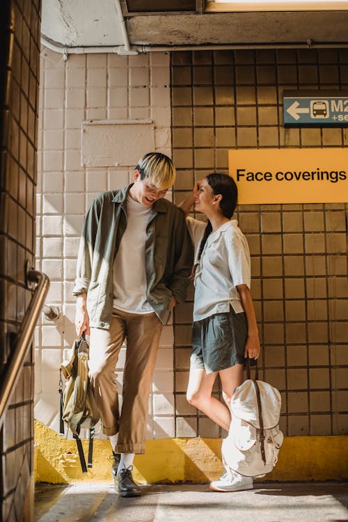 Free Content Asian couple standing in roofed crossing and chatting Stock Photo