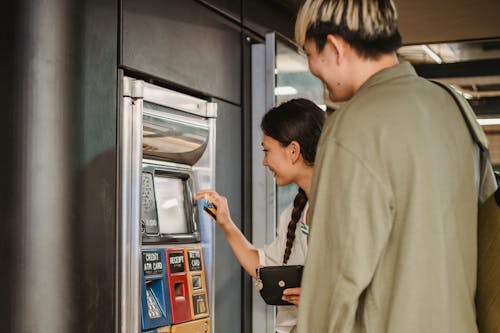 Free Tevreden Koppel Met Kaartjesautomaat In De Metro Stock Photo