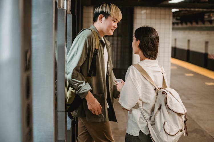Stylish Young Ethnic Couple Entering Underground Station