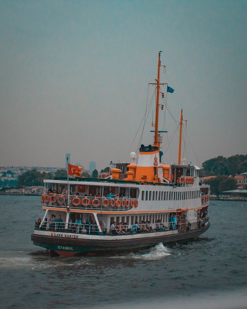 Free A lively ferry boat sails on the Bosphorus in Istanbul, showcasing Turkish seafaring culture. Stock Photo