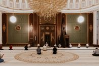 People Sitting on Floor Inside Building