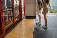 Young couple holding hands while waiting for funicular