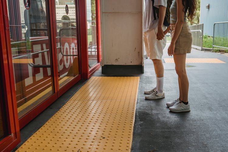 Young Couple Holding Hands While Waiting For Funicular