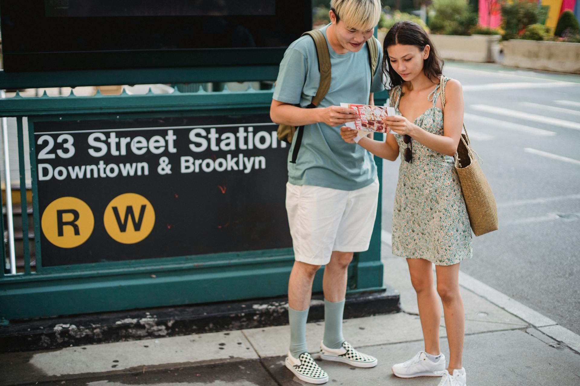 Serious diverse couple searching way on map