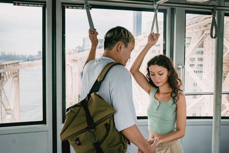 Loving Ethnic Couple Riding Train