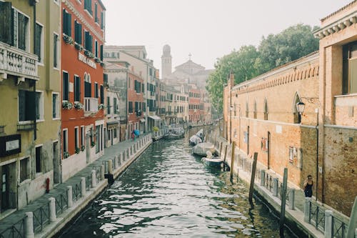 Boats on Canal Between Buildings