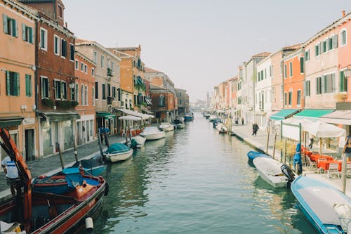 Boats on Canal Between Buildings