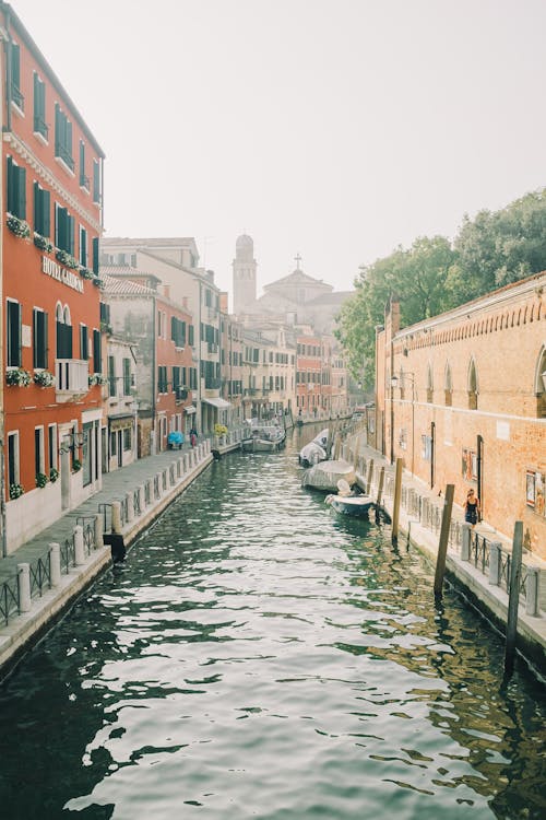 Boats on Canal Between Buildings