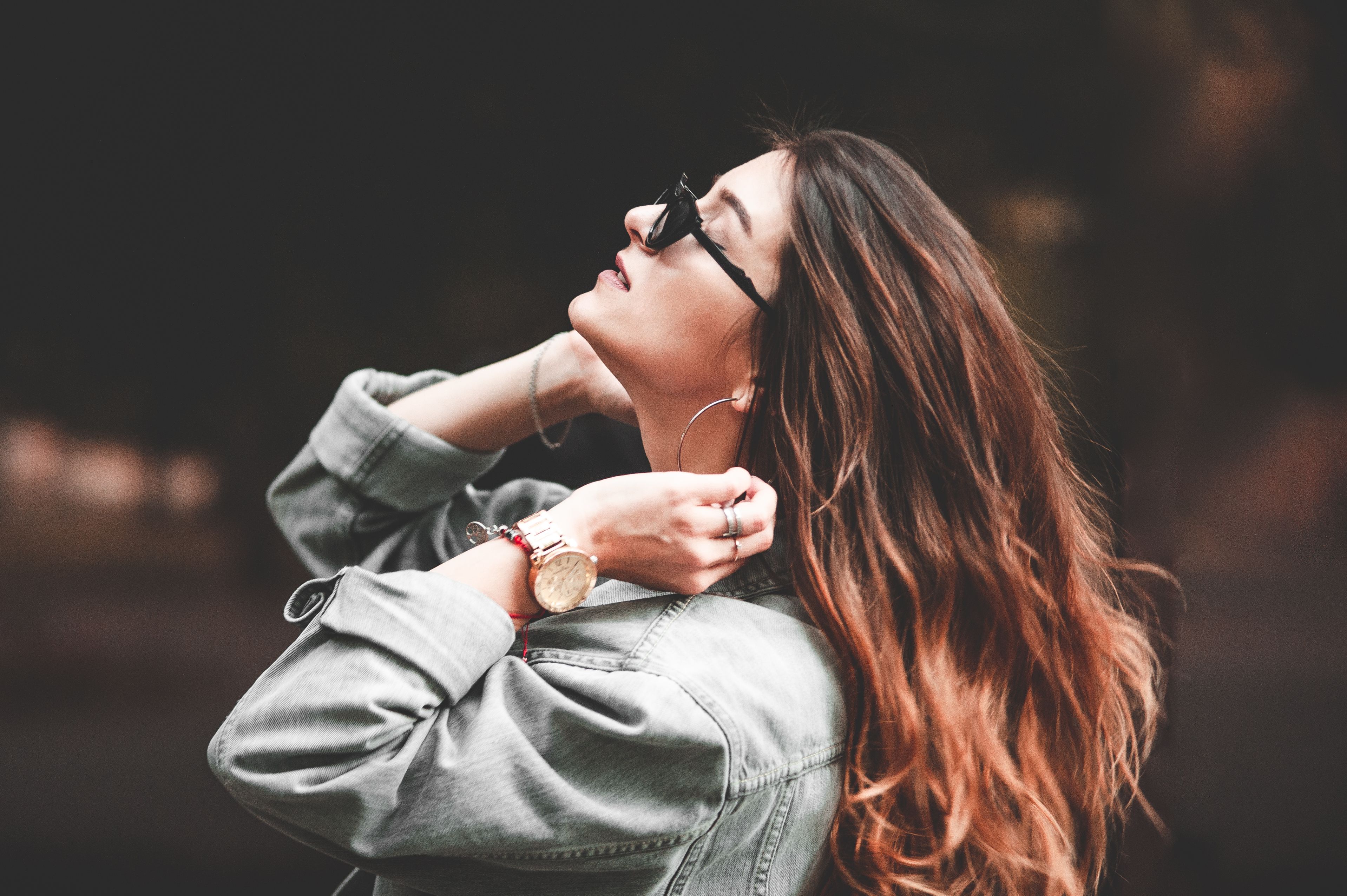 A Woman in Denim Jacket Wearing Black Sunglasses · Free Stock Photo