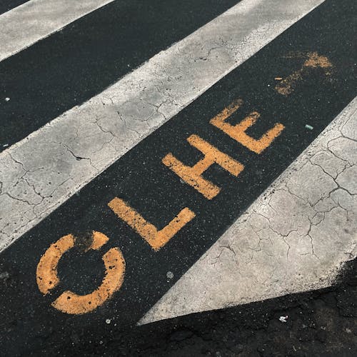 Warning Sign on Asphalt Road on Street