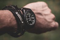 A Person Wearing Black Wristwatch